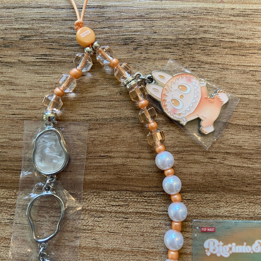 NWOT Big into Energy Labubu phone charm (“happiness”)! 🧡
